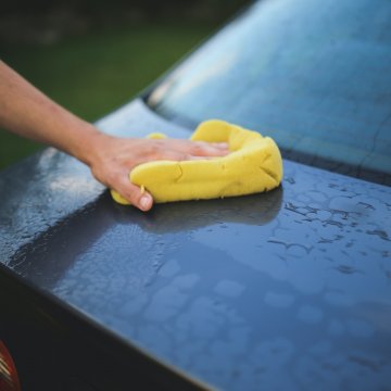 cleaning a car before polishing